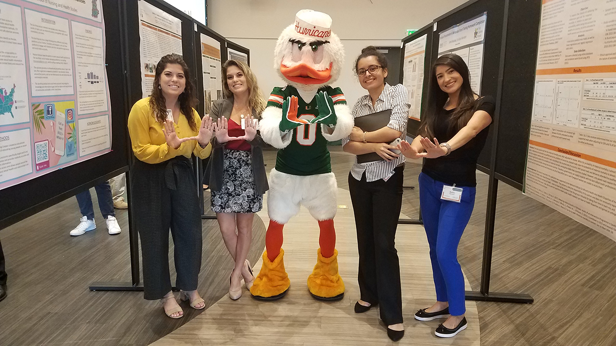 Sebastian throwing the U with RCIF students